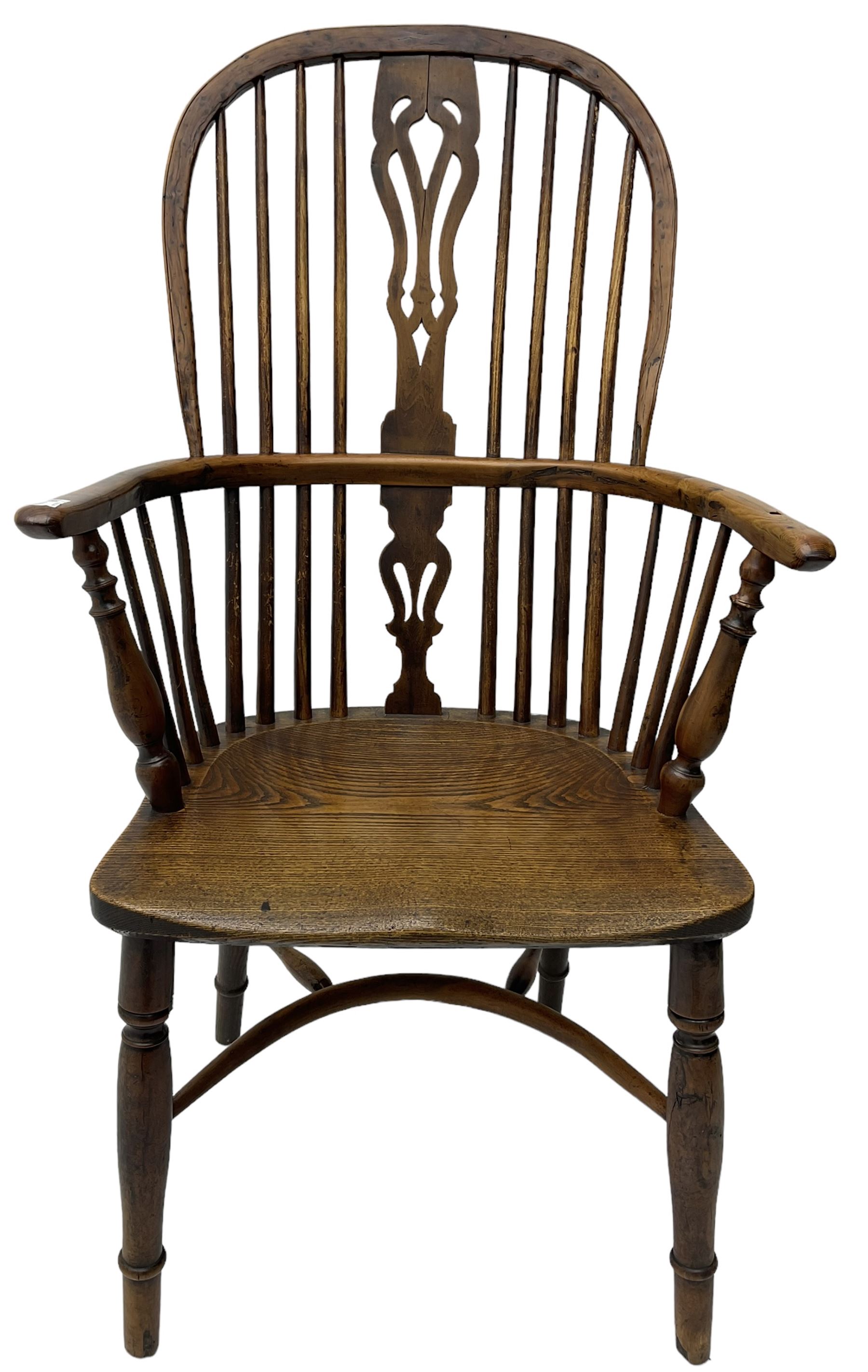 19th century yew wood and elm Windsor chair, high hoop and stick back with pierced splat over dished seat, raised on ring turned supports united by crinoline stretcher