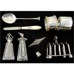  Collection of small hallmarked silver items including miniature toast rack, napkin rings, fruit knife, cut glass condiments with combined spoons and lids by John Grinsell & Sons etc  