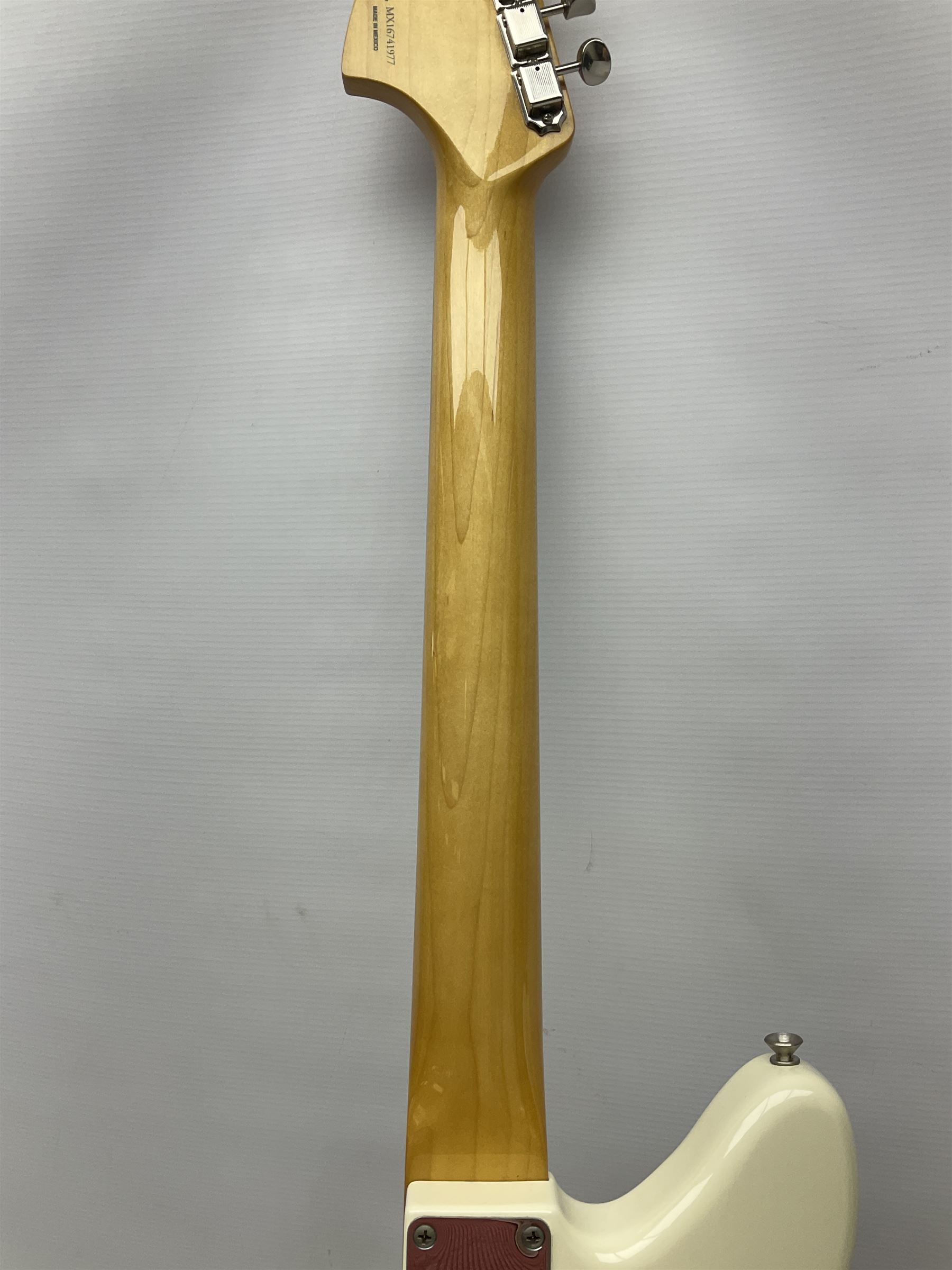 Mexican Fender Jaguar electric guitar with Humbucker pick-ups and tremolo arm, serial no.MX16741977, L101cm; in soft carrying case