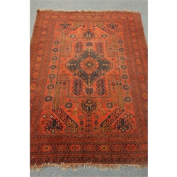  Afghan red and blue ground rug,decorated with stylised motifs and central medallion, 282cm x 201cm  