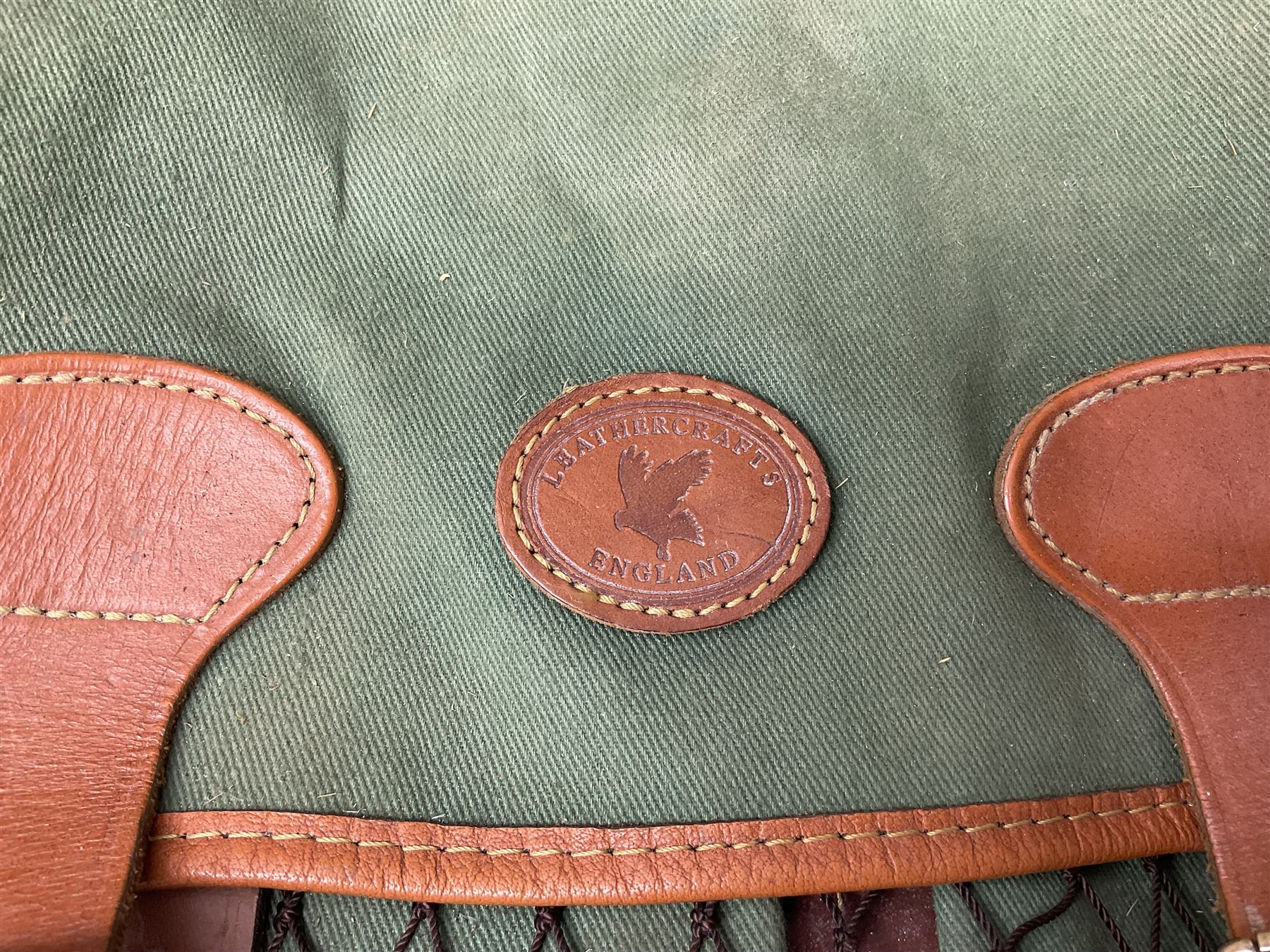 Miscellaneous shooting accessories - W.J. Bowman & Sons clay pigeon launcher; two leather cartridge belts; three cartridge bags; two canvas/leather game bags; and two metal/wooden cartridge boxes