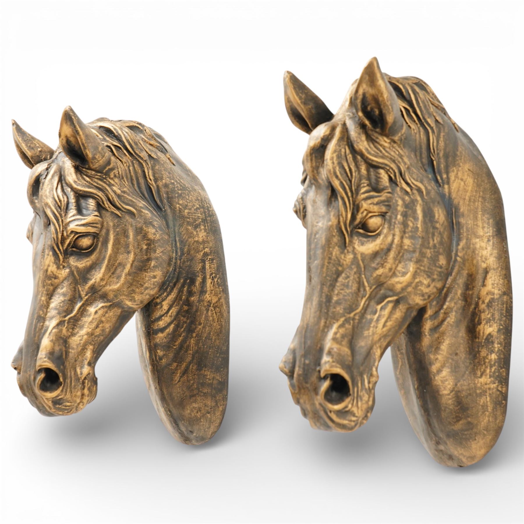 Pair of bronzed painted metal horse head wall mounts, 51cm 