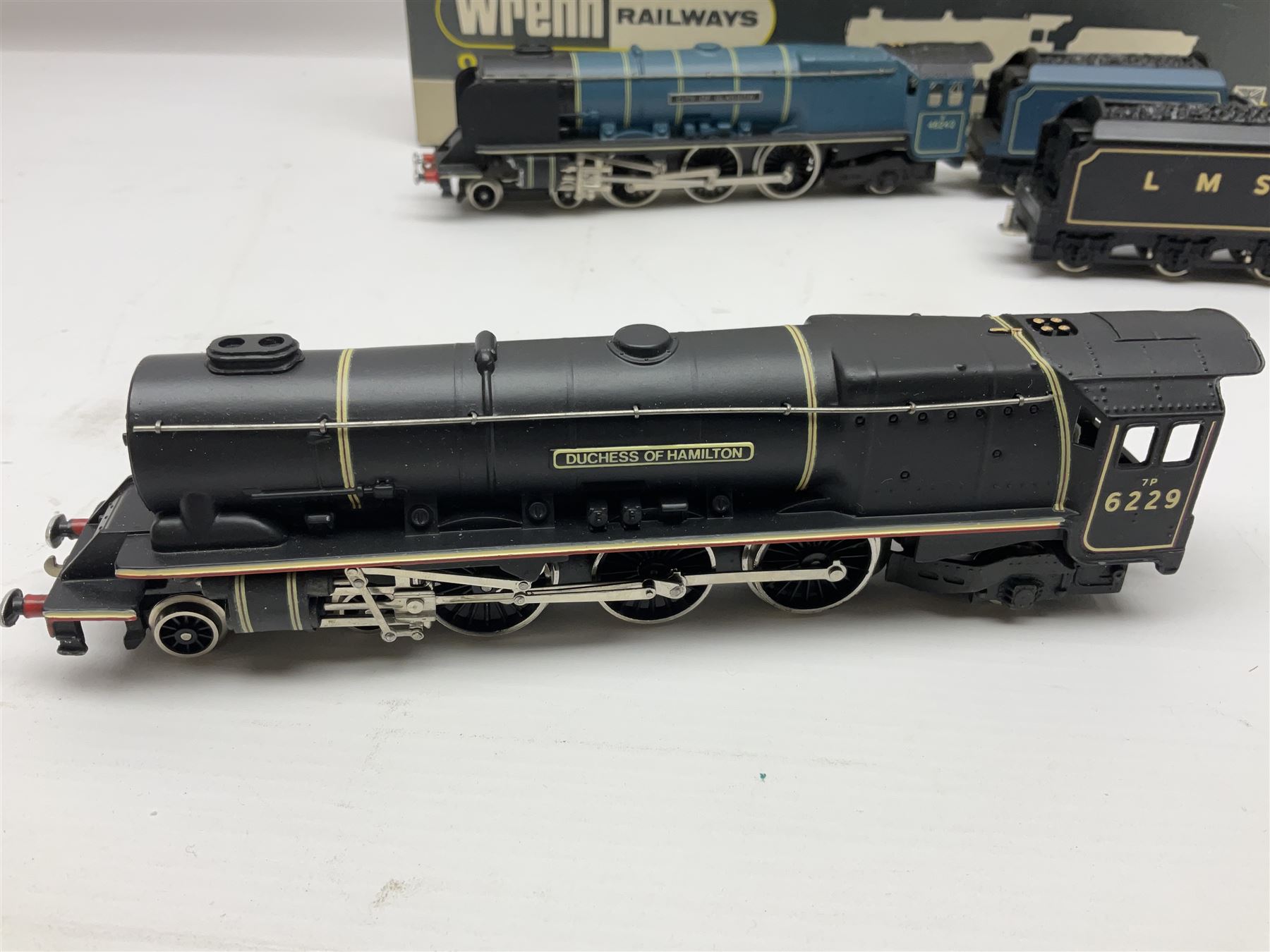 Wrenn '00' gauge - two Princess Coronation (Duchess) Class 4-6-2 locomotives - 'City of Glasgow' No.46242 in BR Blue; and 'Duchess of Hamilton' No.6229 in LMS Black; both boxed with instructions (2)