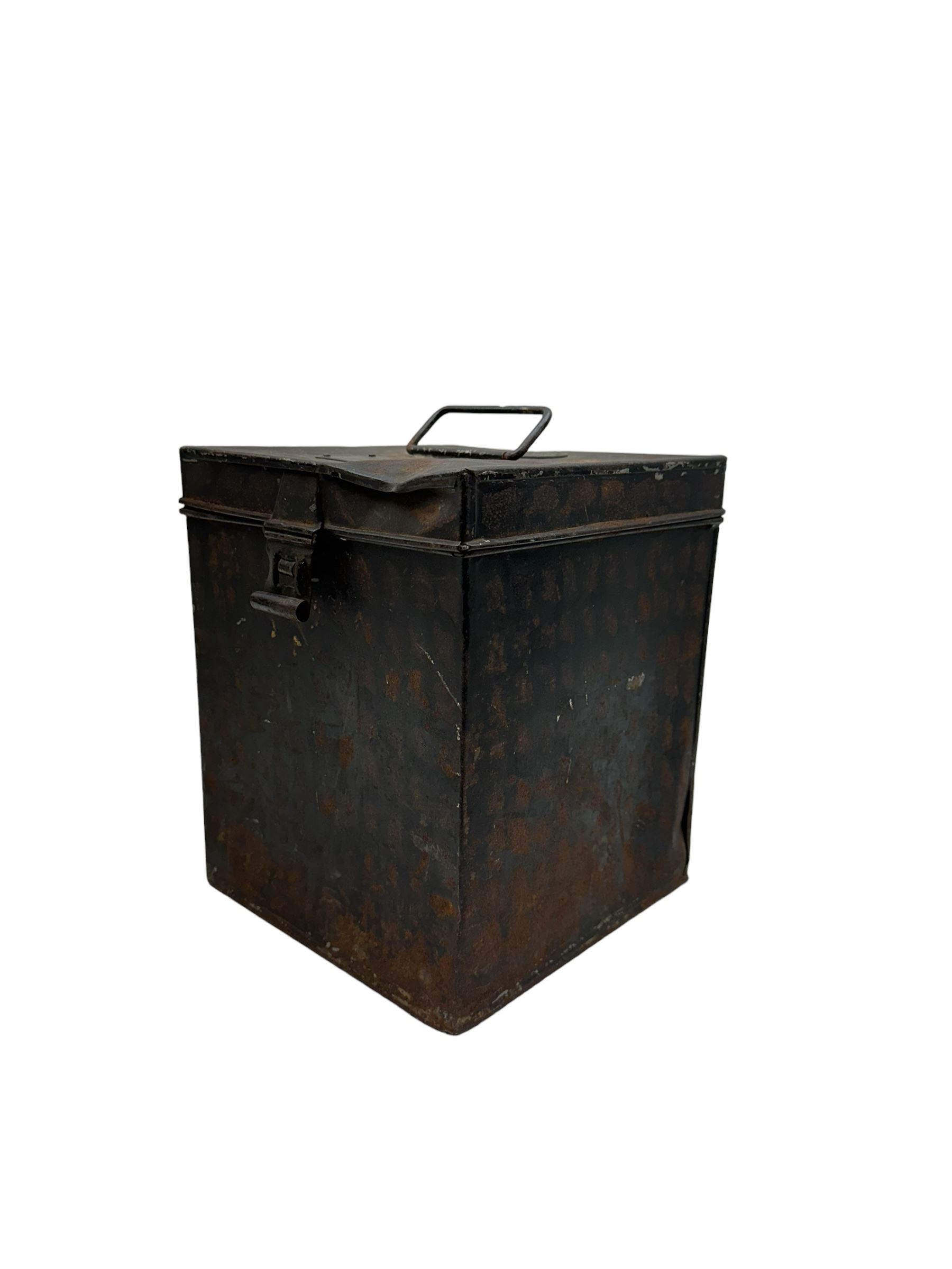 16th Queens Lancers Officers Lance Cap, black leather body with gilt braid lace and gilt wire braiding to the peak, officers silver gilt helmet plate to the front, the black cloth mortar board top with thick bullion wire, the bullion socket holder with embroidered GR cipher to the centre, lion head side bosses with velvet backed linked chinstrap, interior with leather sweatband and cloth lining, marked Carter & Co Pall Mall, the helmet is housed in japanned storage tin with brass plaque engraved “Lieu H L Evans, 16th Lancers'