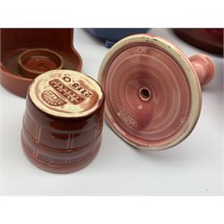 Two Bretby jardinières, hexagonal planter and trumpet shaped vase,  preserve pot and chamberstick together with an Ault pink glazed candlestick and low comport (8)