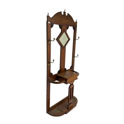 Early 20th century oak hall stand, central lozenge shaped bevelled mirror, flanked by four coat hooks, small compartment with hinged lid flanked by two umbrella stands