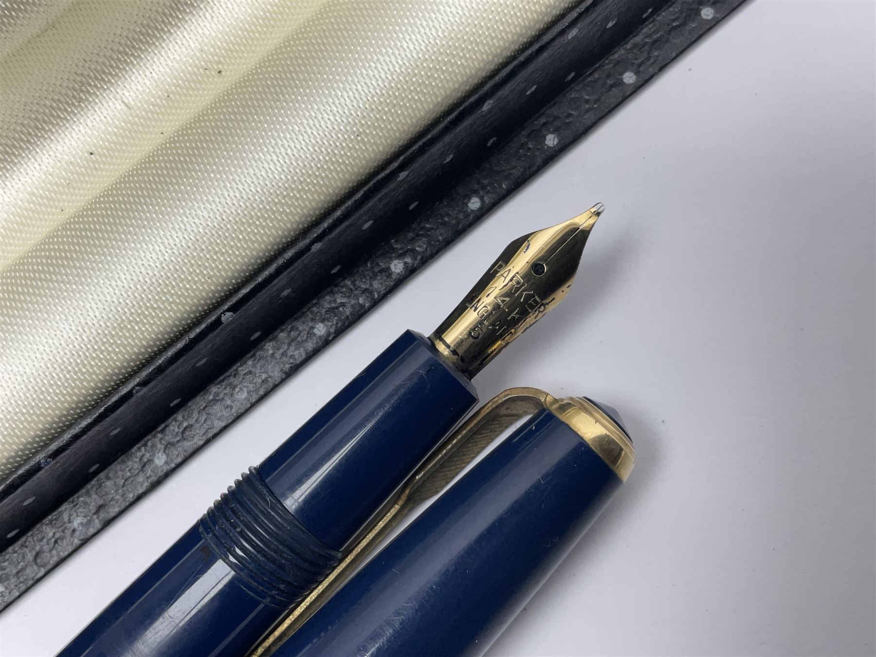 Three fountain pens, to include Conway Stewart 'Dinkie 550' and 'Conway 57' and a Parker 'Slimfold', all with 14ct gold nibs, together two roller ball pens, including a Parker example and a Swarovski Crystal paperweight