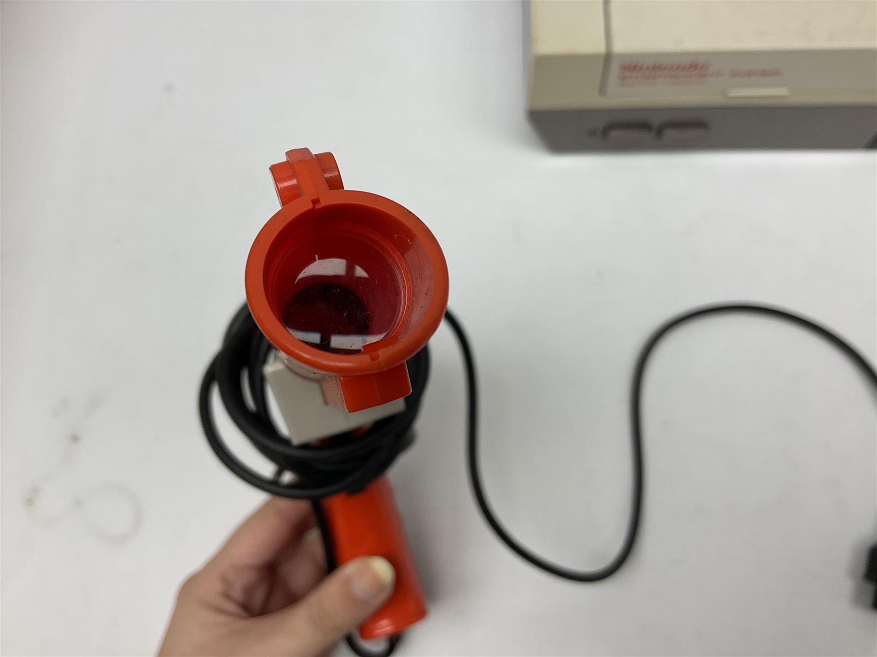 Nintendo Entertainment System (1985) console with two controllers, accessories and instruction booklet. NES Games ‘Duck Hunt’ with Nintendo Zapper gun, ‘Pinball’ and ‘Super Mario Bros.’, all with original sleeves and instruction booklets. NES game ‘Super Mario Bros. 2’ cartridge only