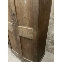 Early 20th century oak cupboard, enclosed by two panelled doors, the interior fitted with shelves and single drawer, on skirted base - THIS LOT IS TO BE COLLECTED BY APPOINTMENT FROM THE OLD BUFFER DEPOT, MELBOURNE PLACE, SOWERBY, THIRSK, YO7 1QY