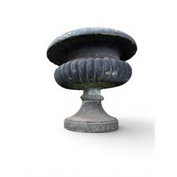 Carved sandstone garden urn, gadrooned campana form