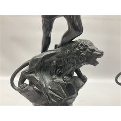 Pair of spelter figures, Le Force and Le Pouvoir, modeled as figures standing on lions, arms held aloft, H51cm 