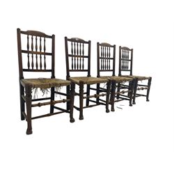 Set four 19th century country elm dining chairs, high back with spindle supports over rush seats, raised on turned supports with pad feet, united by stretchers