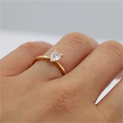 18ct rose gold diamond ring, three claw set with a single pear cut diamond of 0.52 carat, hallmarked, boxed with with GIA report