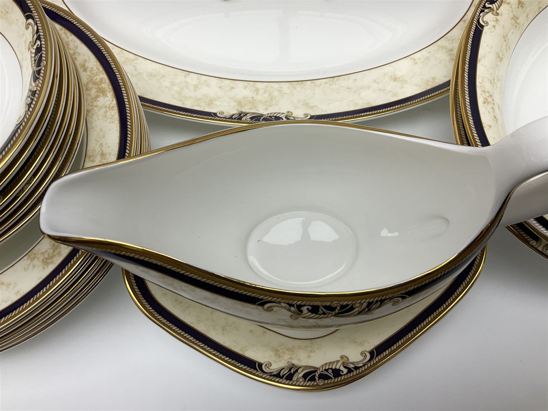 Wedgwood Cornucopia part dinner service, comprising six dinner plates, six soup bowls, six bowls, two serving platters, two oval dishes, covered serving dish, sauce boat and saucer (25)