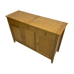 Light oak finish sideboard, fitted with three drawers and cupboards