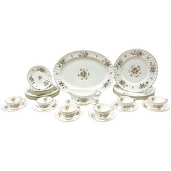 Minton Marlow pattern part dinnerware, comprising oval serving platter, six dinner plates, six sides plates, six tea plates, gravy boat and stand, six cups and saucers.  