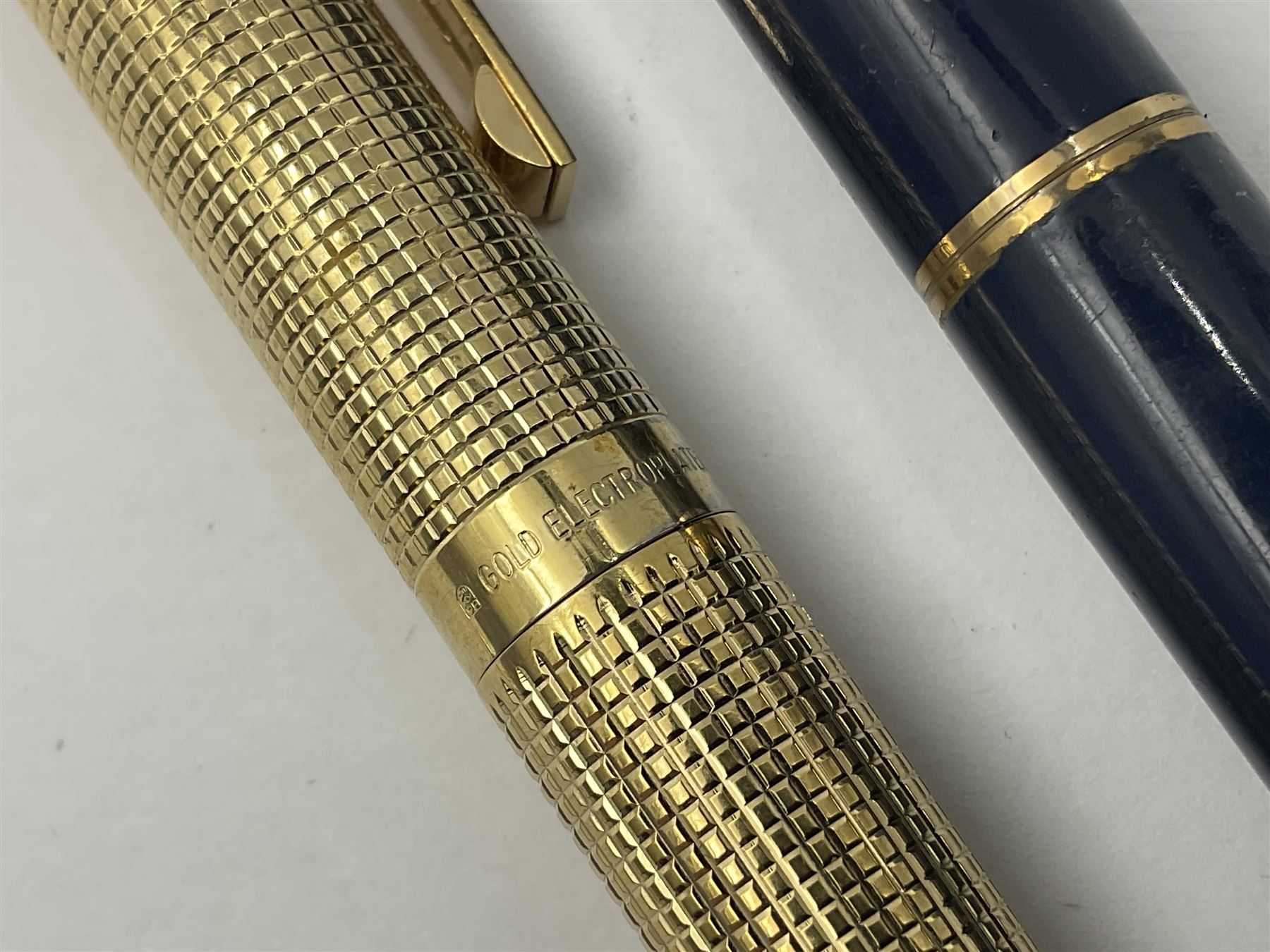 Sheaffer Targa 1011 Diamond Square fountain pen, the gold plated barrel with nib stamped 14K 585, together with another Sheaffer Targa fountain pen with blue barrel and gold nib stamped 14K 585 and matching ballpoint, and Sheaffer ballpoint pen with sterling silver barrel, largest L13.5cm (4)