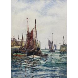 Frank (Frederick) William Scarborough (British 1860-1939): Whitby and Kirkcaldy boats in Harbour, watercolour signed 33.5cm x 24cm 
Provenance: with the Mangate Gallery London, label verso