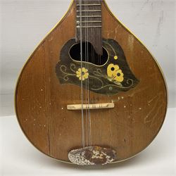 Italian eight-string mandolin with maple back and ribs and spruce top with inlaid floral marquetry panel within a fragmented mother-of-pearl border L61cm; cased; and a (damaged) German 'Michigan' mandolin for spares or repair (2)