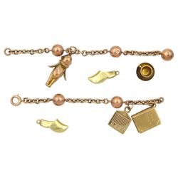 Rose gold link bracelet, four 9ct gold charms including teacup and saucer, Love story book and a pair of 14ct gold clogs