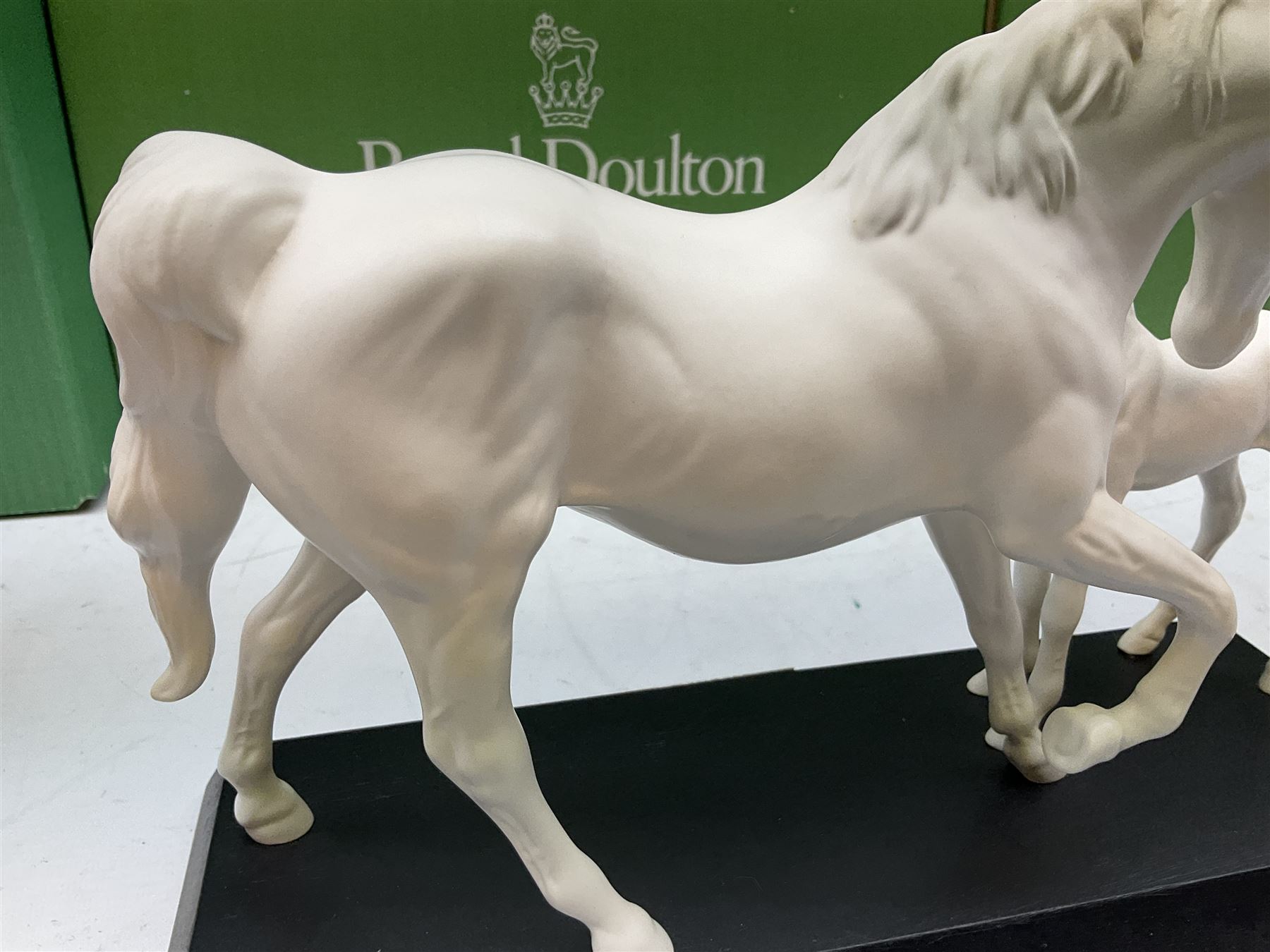 Five Beswick and Royal Doulton horse figures in matt white on black plinths, comprising of  Spirit of Affection no. 2689/2536, Springtime no.2837, Spirit of peace no.2916, Spirit of earth no.2914 and Spirit of the wild no. 183, together with a composite figure of a horse (6)