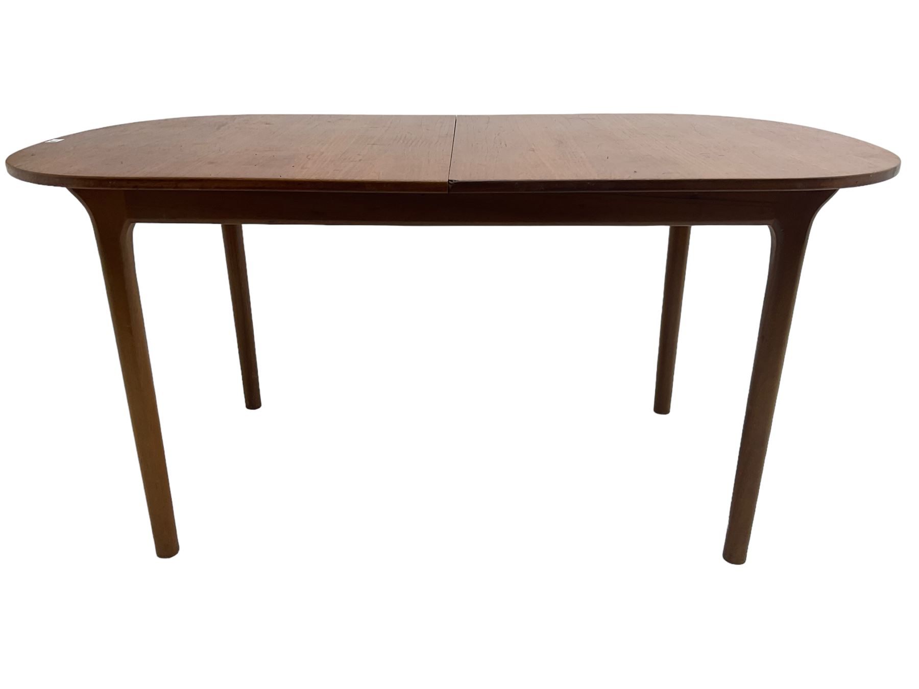 AH McIntosh & Co of Kirkaldy - mid-20th century teak extending dining table, rectangular top with rounded corners, concealed integrated double leaf, raised on tapered supports, 'Furniture by McIntosh sticker to underside of leaf