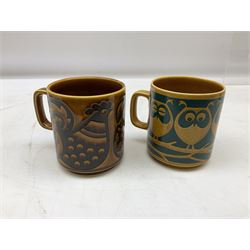 Collection of 1970s Hornsea mugs designed by John Clappison, comprising six Train Robber pattern examples together with owl patterned example on dark teal ground, and further example decorated with stylised hen and chick and egg, approx 9cm, together with four small cup bowls, all with stamped Hornsea marks beneath