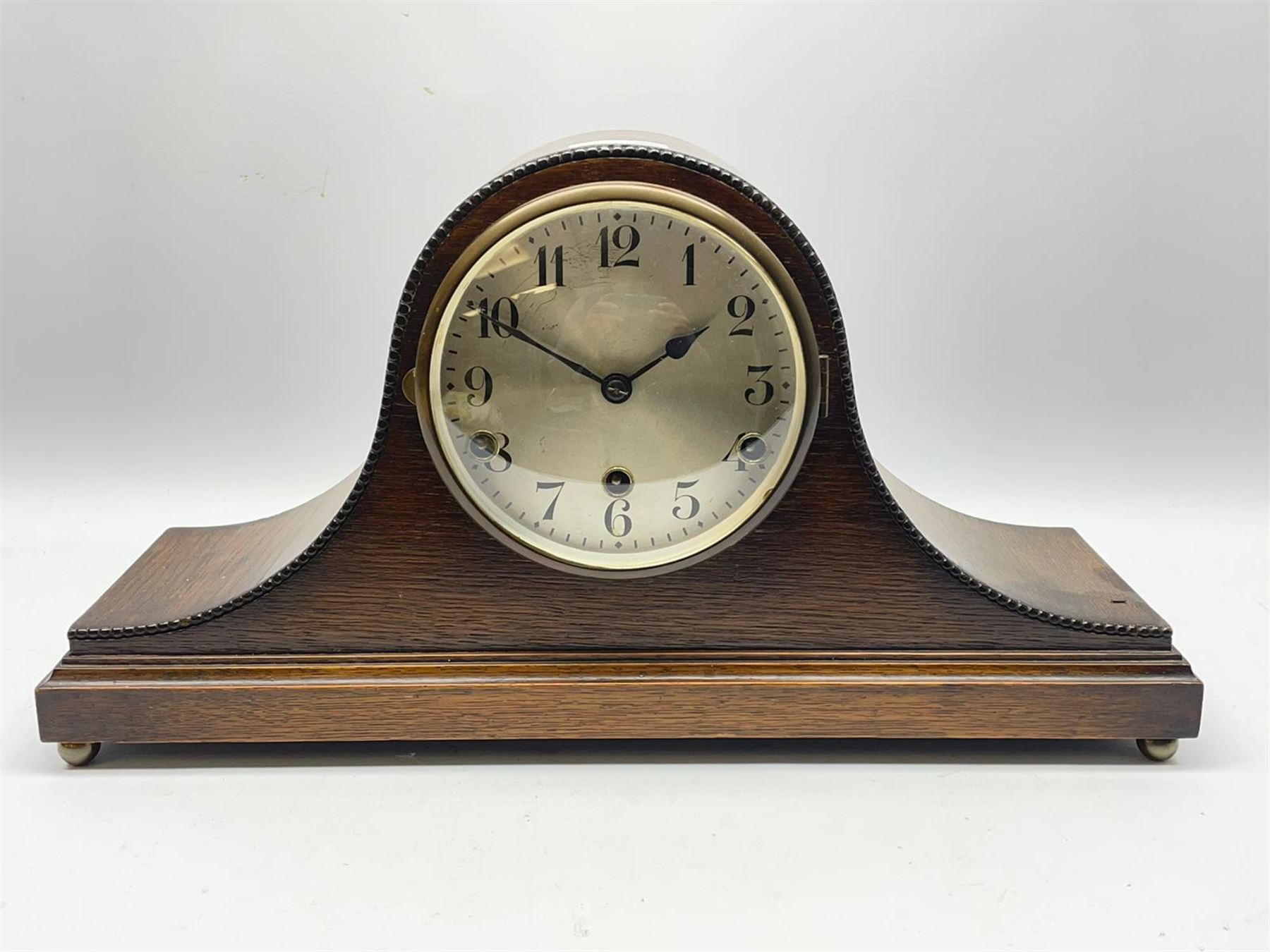 Early to mid 20th century oak mantel clock, silvered Arabic dial, triple train driven quarter Westminster chiming movement