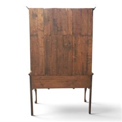 Late 19th century inlaid oak dresser and plate rack, plate rack with projecting cornice and fretwork, with three shaped shelves for plates, central cupboard with inlaid shell and border, brass escutcheon and key, the lower section with crossabanded top, above three drawers with brass handles and inlaid border, shaped apron raised on cabriole supports 