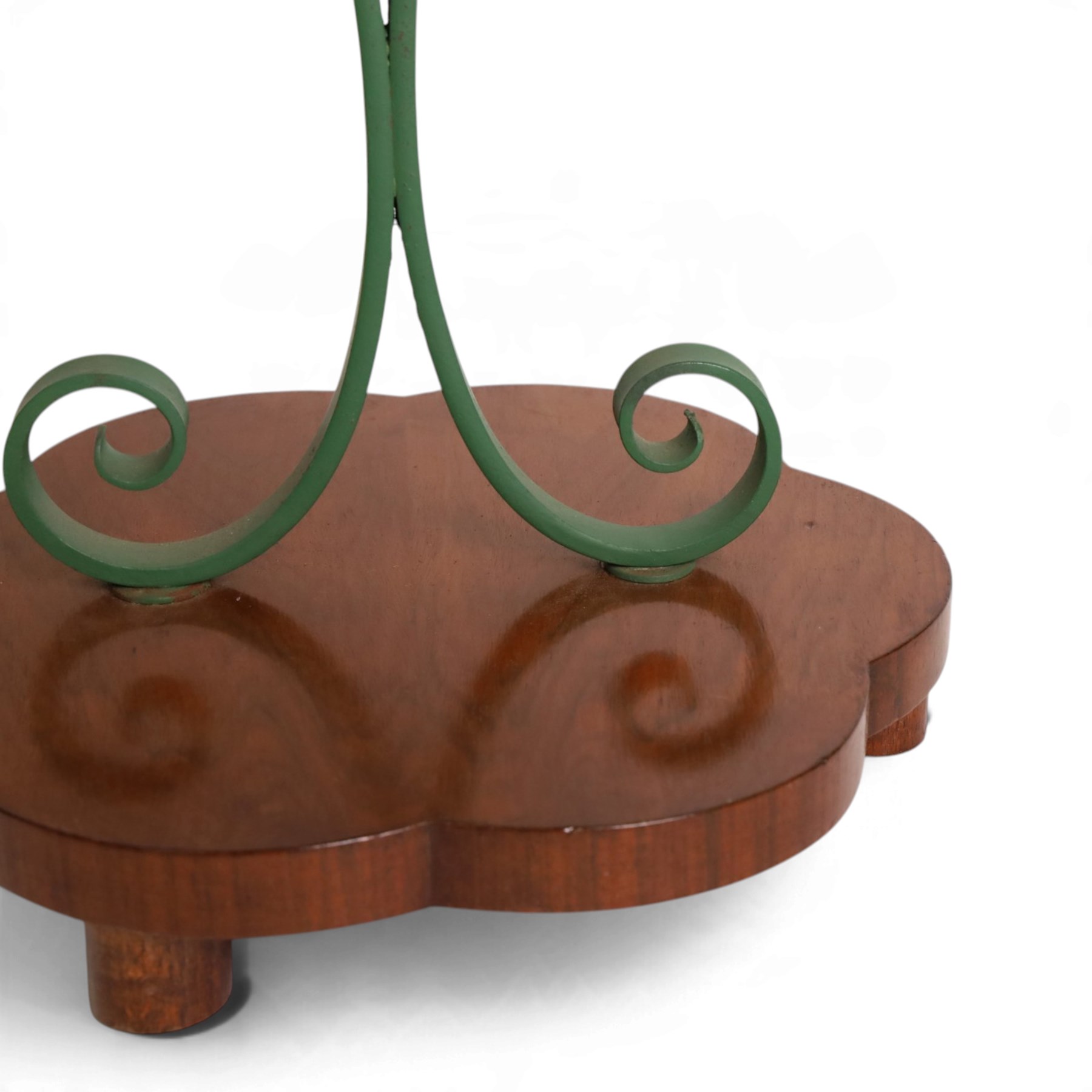 Art Deco stand, with scalloped wooden shelf, within green painted metal frame with scroll detail, upon a scalloped base, H75cm