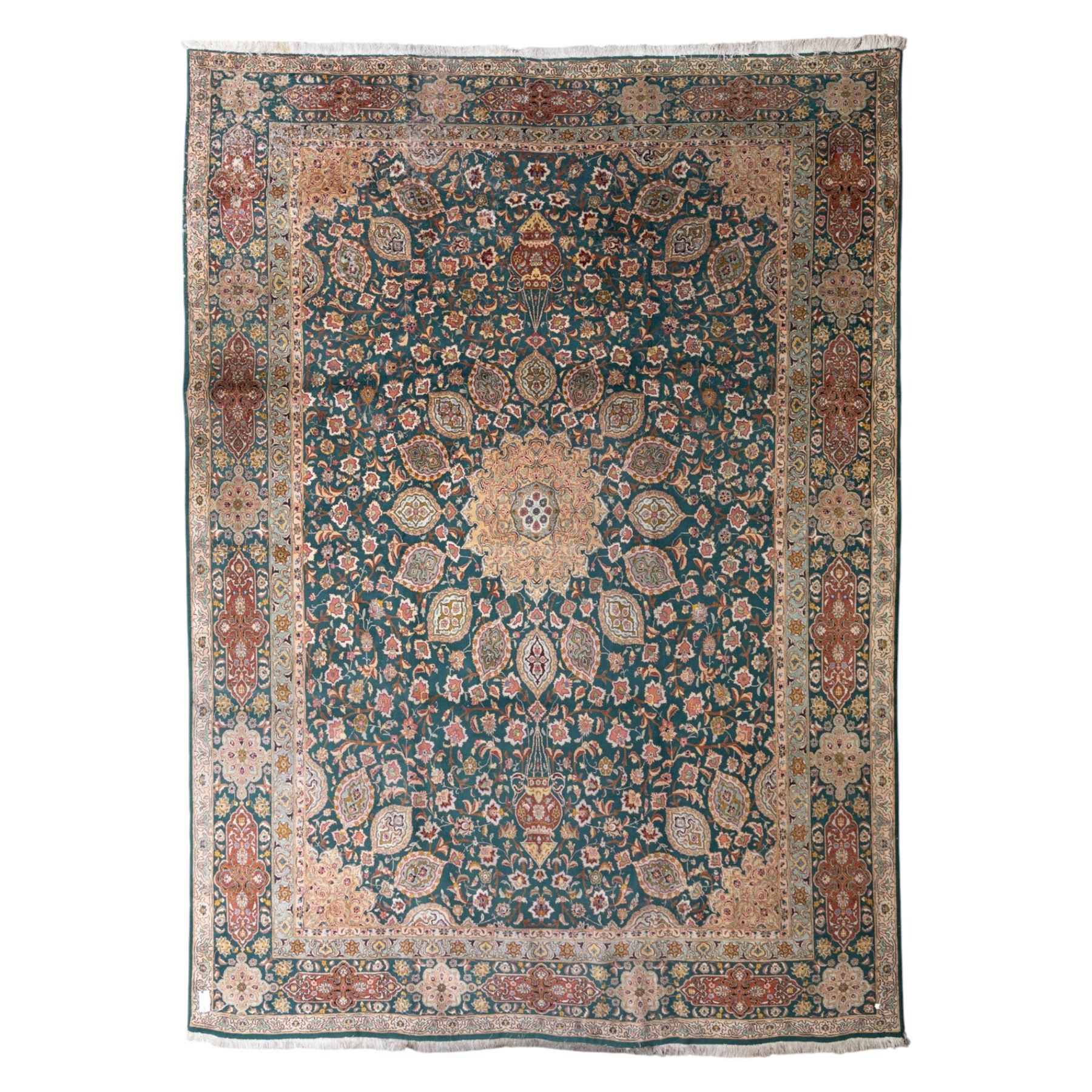 Persian Tabriz type carpet, the teal ground decorated with central medallion, radiating palmettes and dense floral scrollwork, within multiple floral borders