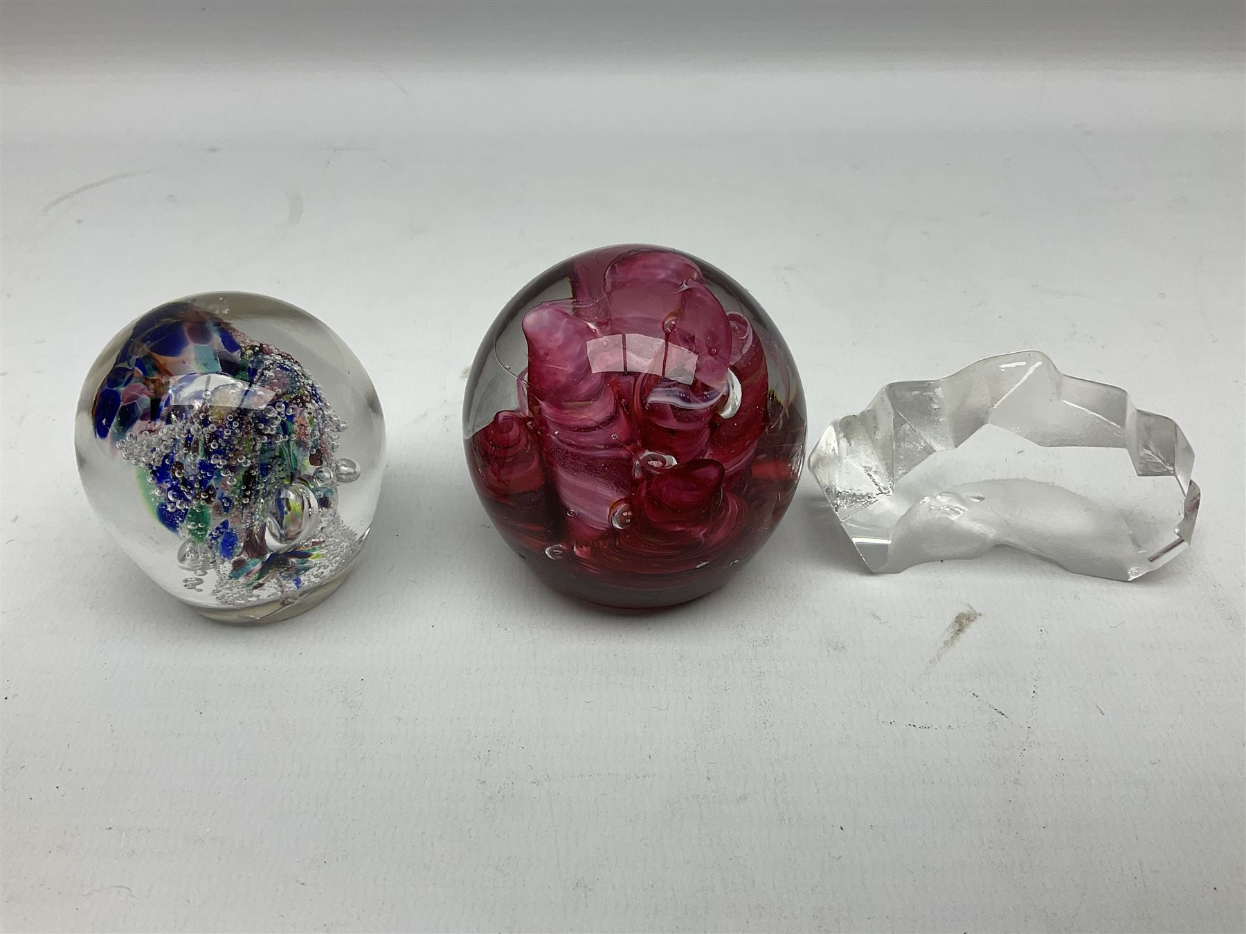 Victorian green glass dump paperweight with internal foil flower