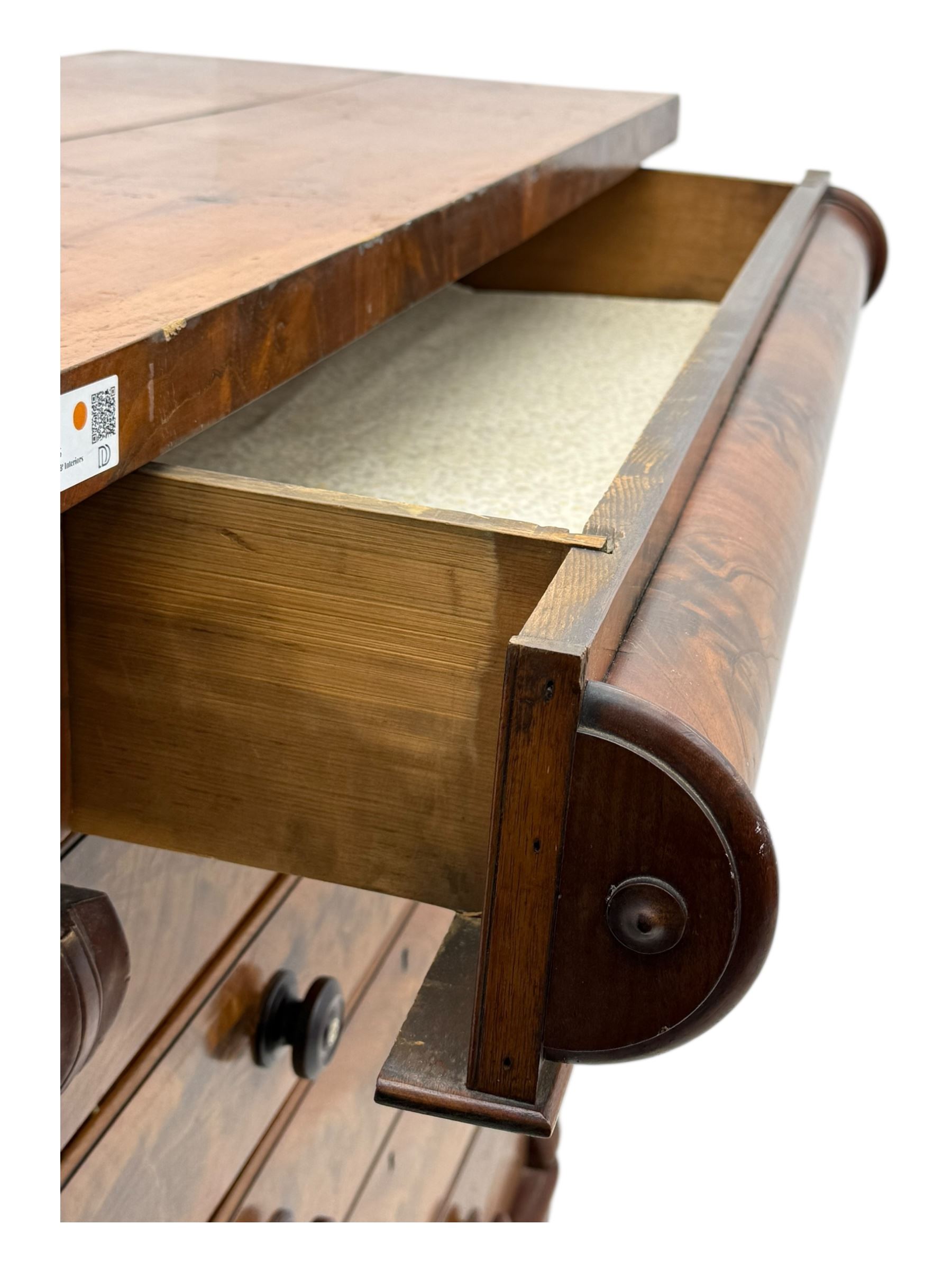 19th century flame mahogany Scotch chest, frieze long drawer above two short and four long graduating drawers, with turned knobs scrolled carved side bracket 