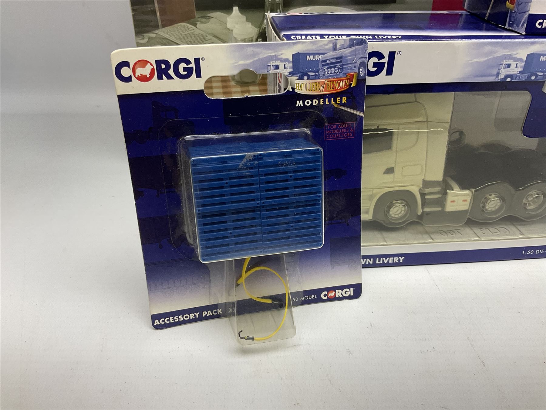 Corgi - limited edition Cafe Connection Albion Reiver Sheeted Platform lorry W.H. Malcolm Ltd Jungle Cafe No.CC11603; and seven Hauliers of Renown Modeller Series vehicles CC19910, 19911, 19912, 19913, 14100, 14000 & 13700 all boxed; together with two Modeller Accessory packs (10)