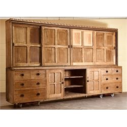 Late Victorian country house pine dresser, the four fielded panelled sliding cupboard doors opening to reveal three shelves, over a base fitted with two adjustable shelves to centre, flanked at each end with a cupboard, two short, and two long drawers, restoration and later elements. H218cm, L375cm, D62cm. - COLLECTION BY APPOINTMENT FROM: The White House, Thirsk Road, Easingwold, York, YO61 3NF - CALL 01723 507111 TO ARRANGE