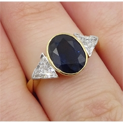  18ct gold oval sapphire and two trillion cut diamond ring, hallmarked, sapphire 2.18, diamond total weight 0.52 carat  