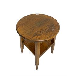 Early to mid-20th century oak tavern table, circular top splayed square supports with peg feet joined by square under tier  