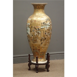  Meiji period Japanese Satsuma floor vase, of ovoid form, decorated with enamels and gilt, having four panels Daimyo Procession, Samurai in full armor and female figures in an interior setting, on grounds of scrolls and geometric designs with hardwood stand, red painted signature to base, H76cm   