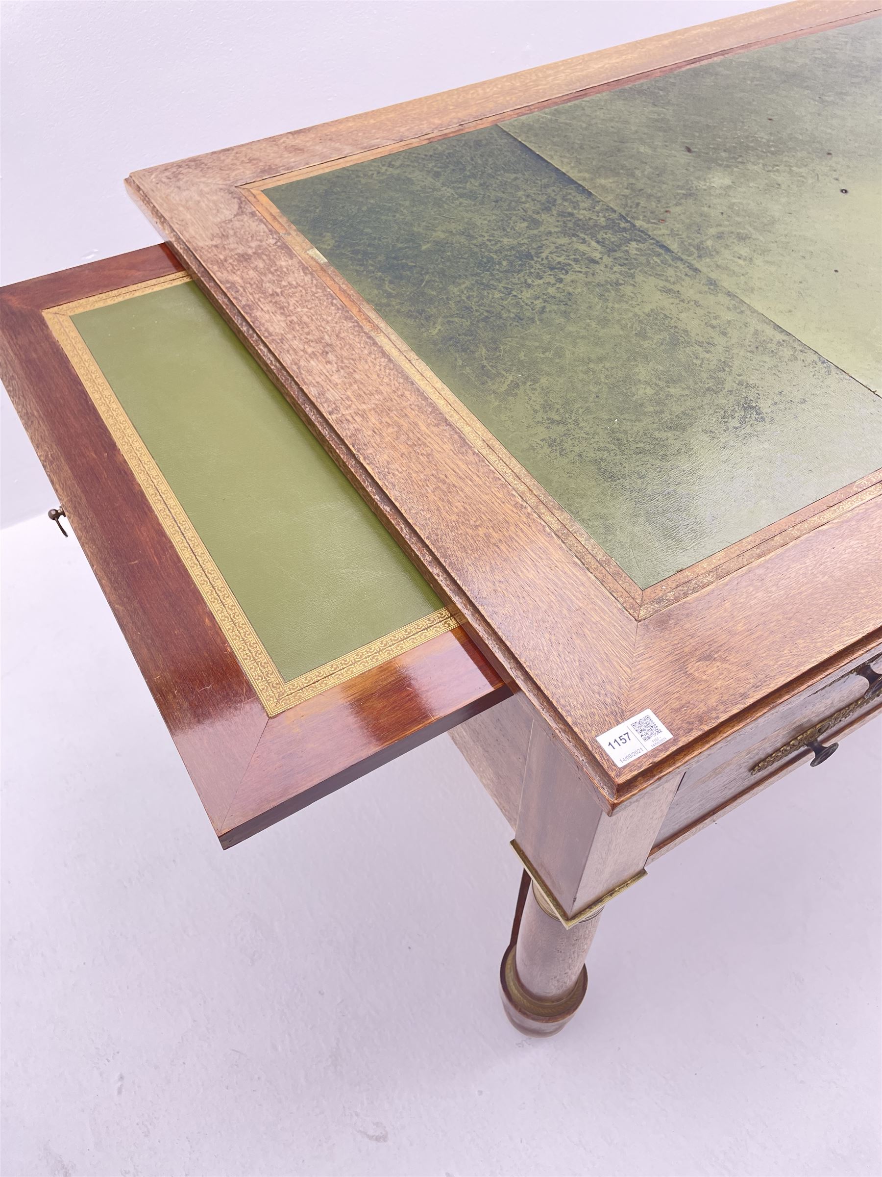 French Empire style walnut desk, moulded rectangular top with inset leather, two leather inset slides either side, fitted with four drawers, turned supports joined by curved x-shaped stretchers, gilt metal mounts 