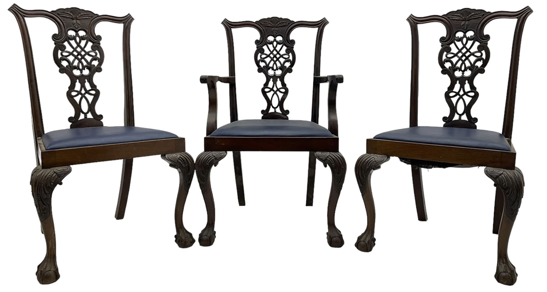 Set of six (5+1) Chippendale design mahogany dining chairs, shaped cresting rail over pierced splat with elaborately carved foliate and scrolling decoration, over drop-in upholstered seats, raised on cabriole supports with scrolled acanthus carved knees and ball and claw carved terminals