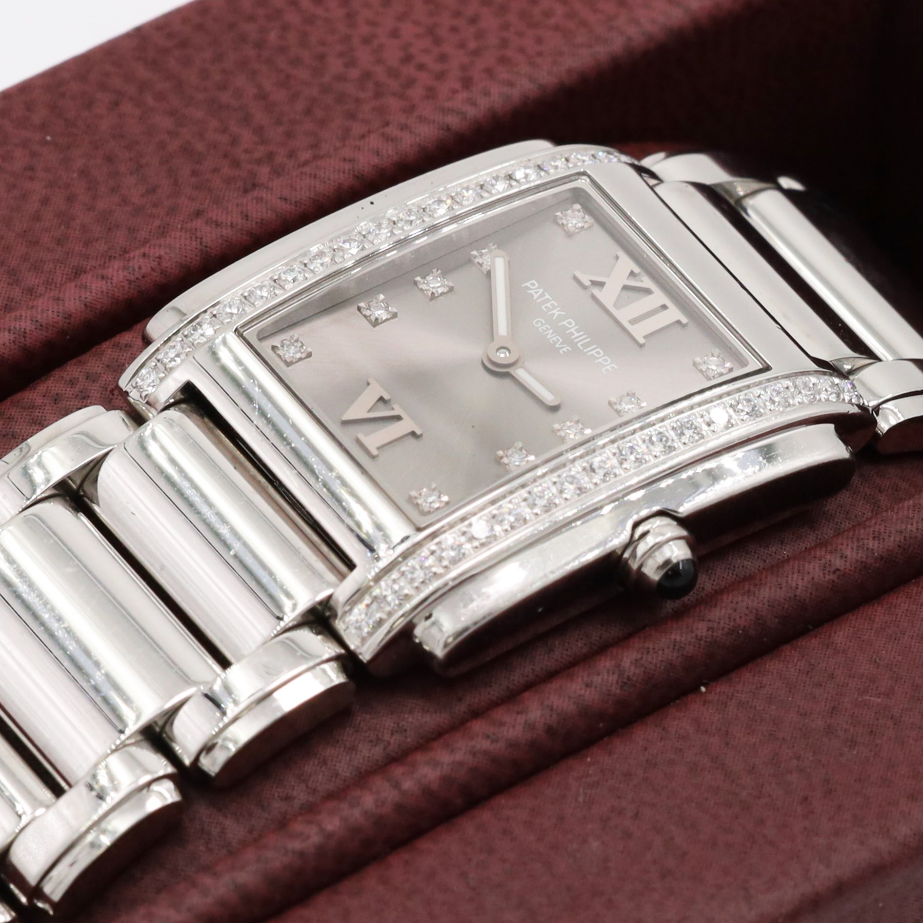 Patek Philippe Twenty~4 ladies stainless steel quartz wristwatch, sunburst grey dial with Roman numeral and diamond dot hour markers and diamond set case, on original bracelet, with fold-over clasp boxed
