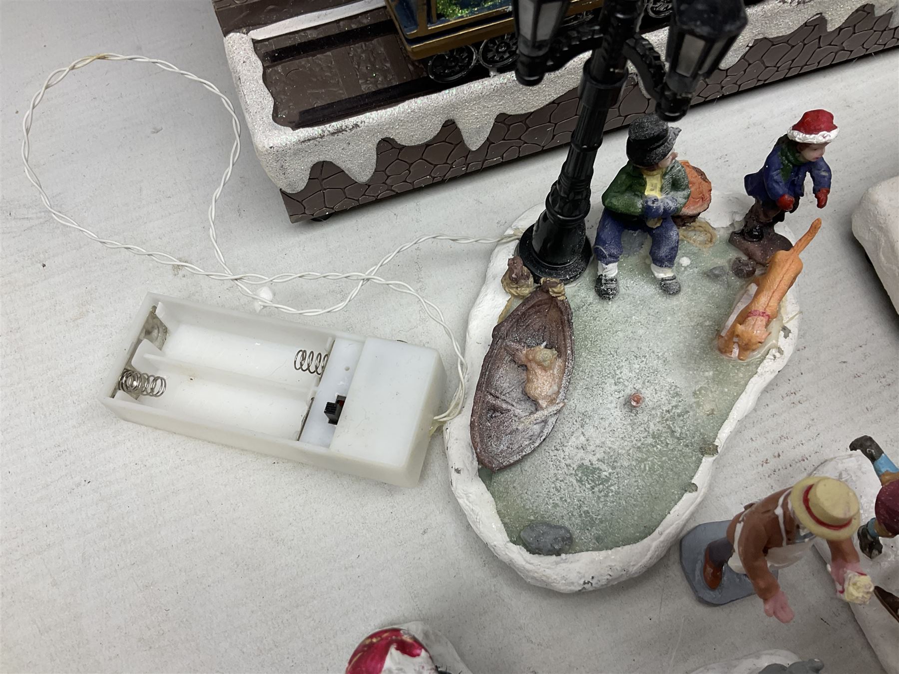 Christmas decorations; Premier LED Christmas Village scene with moving train, together with three Lumineo christmas scenes, and other similar 