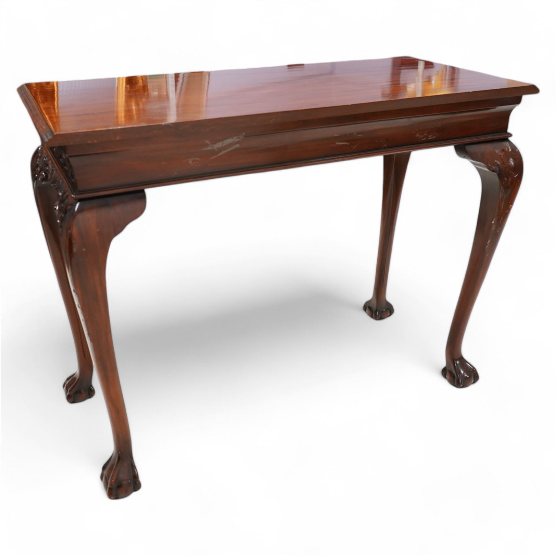Georgian design mahogany console or side table, moulded rectangular top over palmette carved frieze, decorated with scrolling leafage, shell and bell flower carved cabriole supports with ball and claw feet 