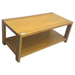 Light oak rectangular coffee table, with exposed finger joints to the corners, raised above a full-length undertier on straight supports