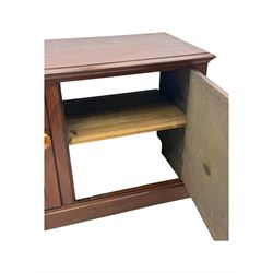 Victorian mahogany cupboard, plain rectangular top above two fielded panel doors opening to shelved interior, raised on a moulded plinth base, with later replacement knob handles