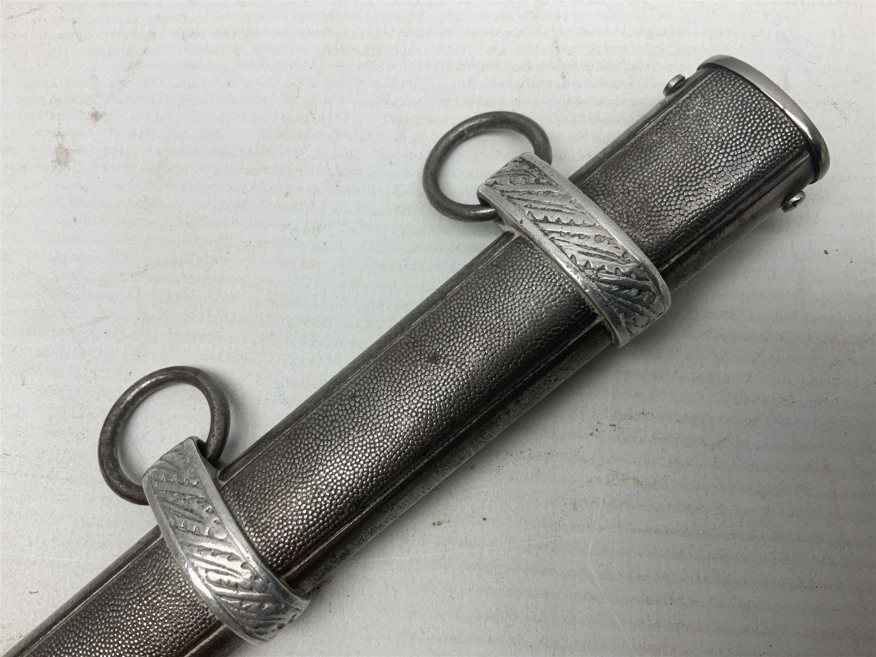 WW2 German Luftwaffe 2nd Pattern Officers dress dagger, with unmarked 25.5cm double edged steel blade, wire-bound pale orange/yellow celluloid grip, globular  pommel with oak leaves and traces of gilding, Luftwaffe eagle cross guard; in beaded scabbard with two suspension rings L43cm overall