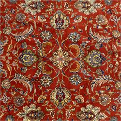 Persian Tabriz hand-knotted carpet, crimson field densely decorated with scrolling floral and foliate motifs, enclosed by a broad cream principal border with repeating floral medallions and multiple guard stripes