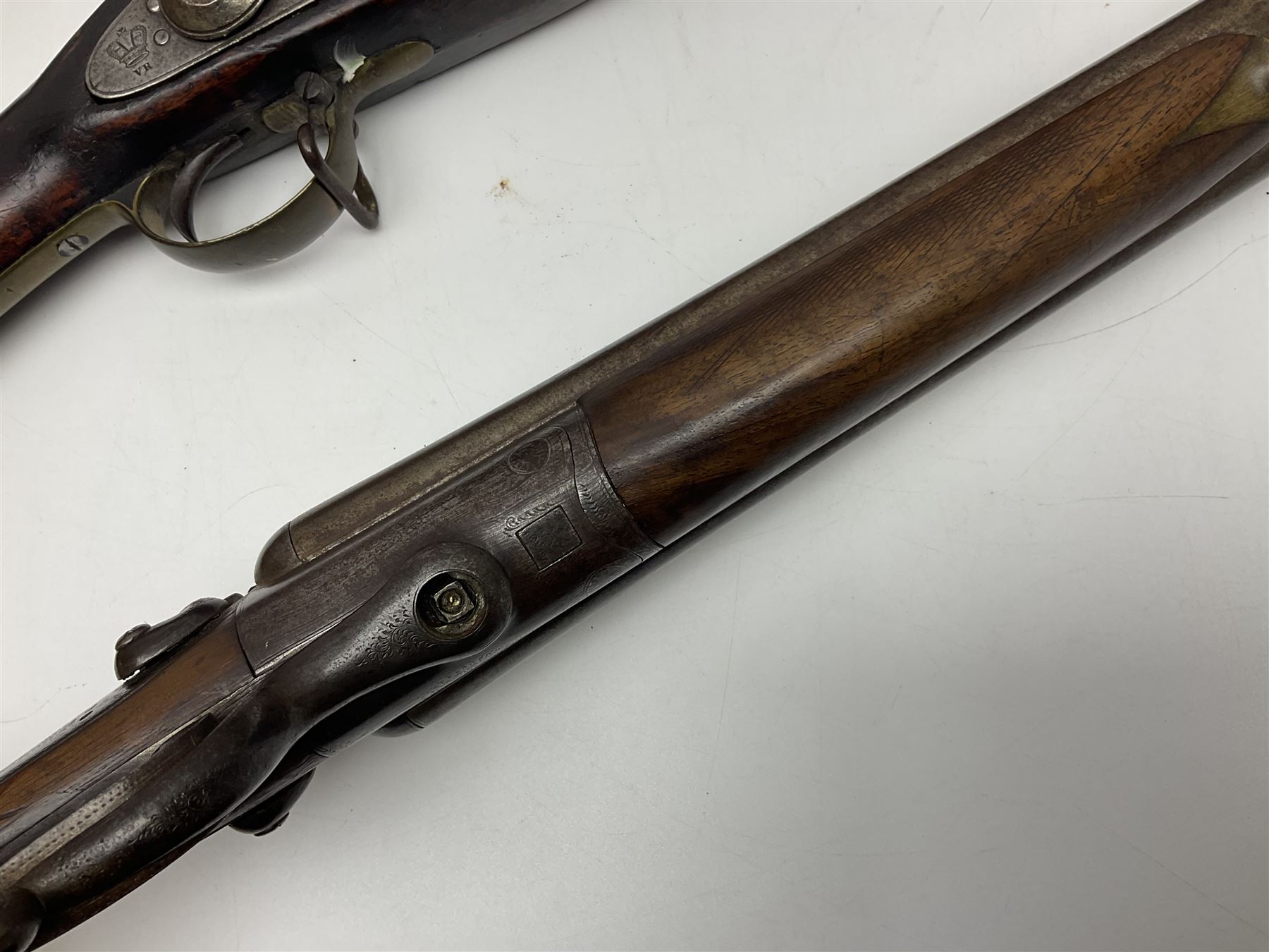 19th century Indian .577 Enfield muzzle loading rifle, proofed for 26-bore, the 98.5cm barrel with three barrel bands and later ram rod L140cm overall; 19th century Belgian side-by-side double barrel percussion shotgun, approximately 20-bore, with 74cm barrels and studded walnut stock, lock plate marked 'Liege 1868' and 'V. Gulikers-Maquinay' L117cm overall; and another side-by-side double barrel shotgun by Smythe with underlever opening (3)