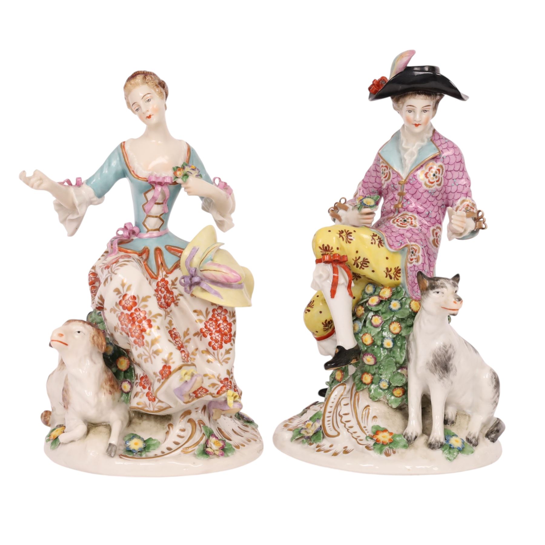 Pair of 19th century Samson figures, the gentleman wearing a wide brimmed hat with a dog, the lady with a sheep by her side, both figures seated upon a floral encrusted pillars with gilt scrolling base, H22cm