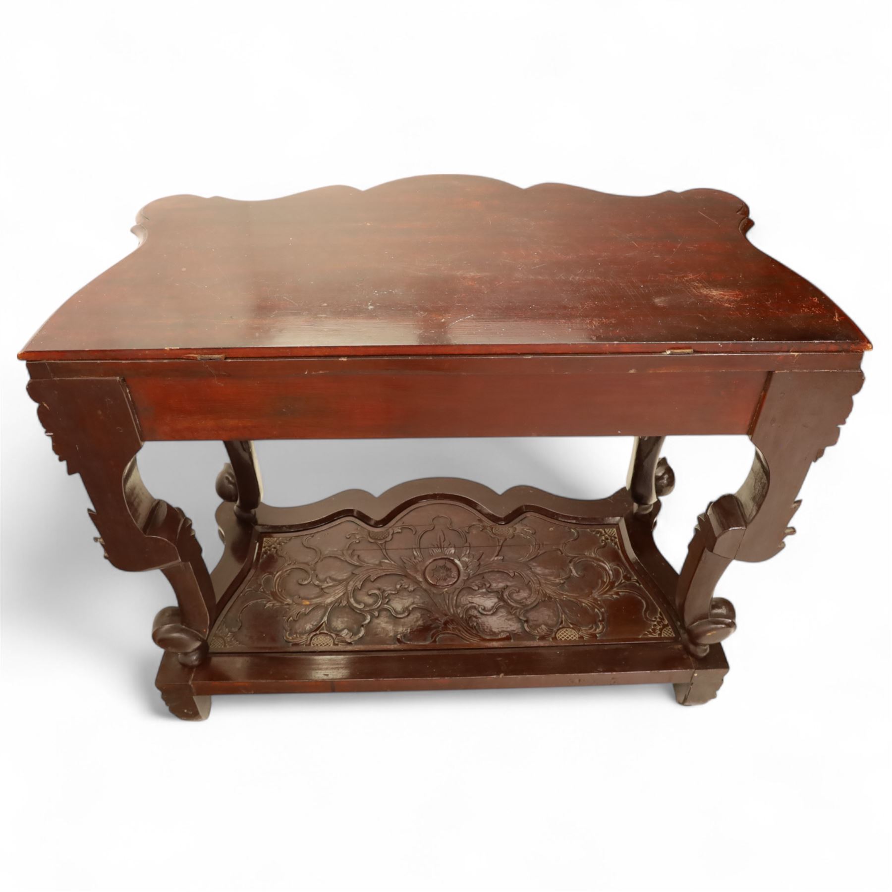 Chinese stained hardwood side table, late Qing dynasty style, with shaped top above a pierced and carved frieze of foliage and fruiting vines, cabriole legs terminating in scroll feet, united by a carved shaped undertier